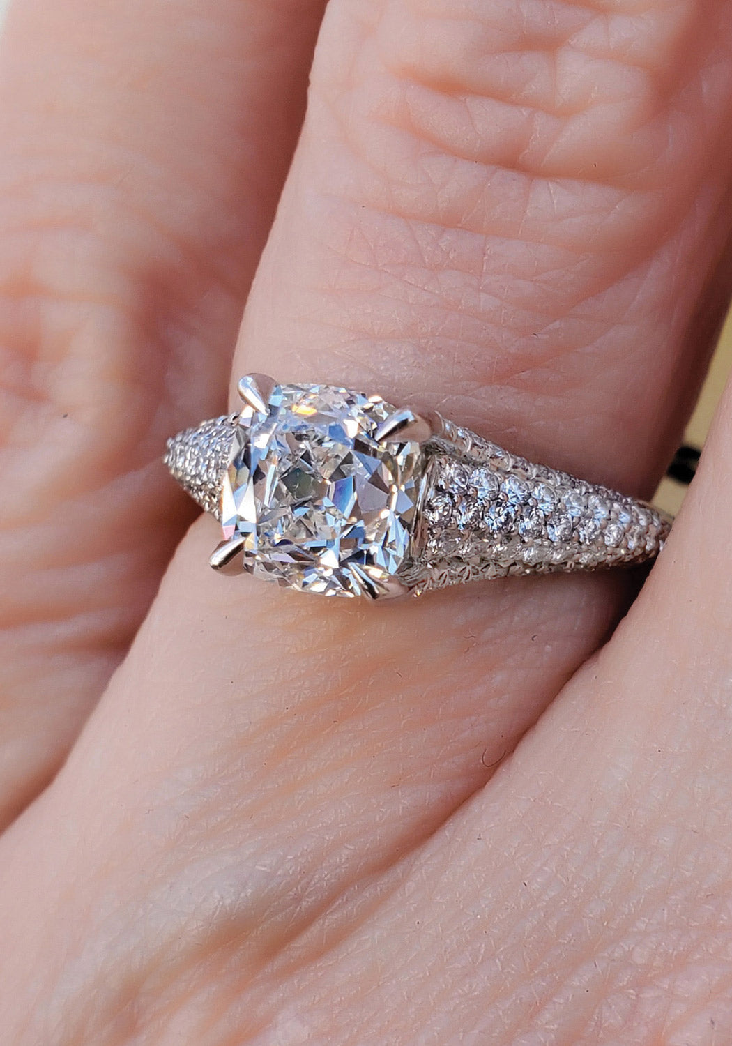 Cushion Cut diamond with pavé shank at Oster Jewelers