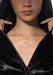 Messika Move 18K White Gold Pavé Diamond Necklace on a model with black coat