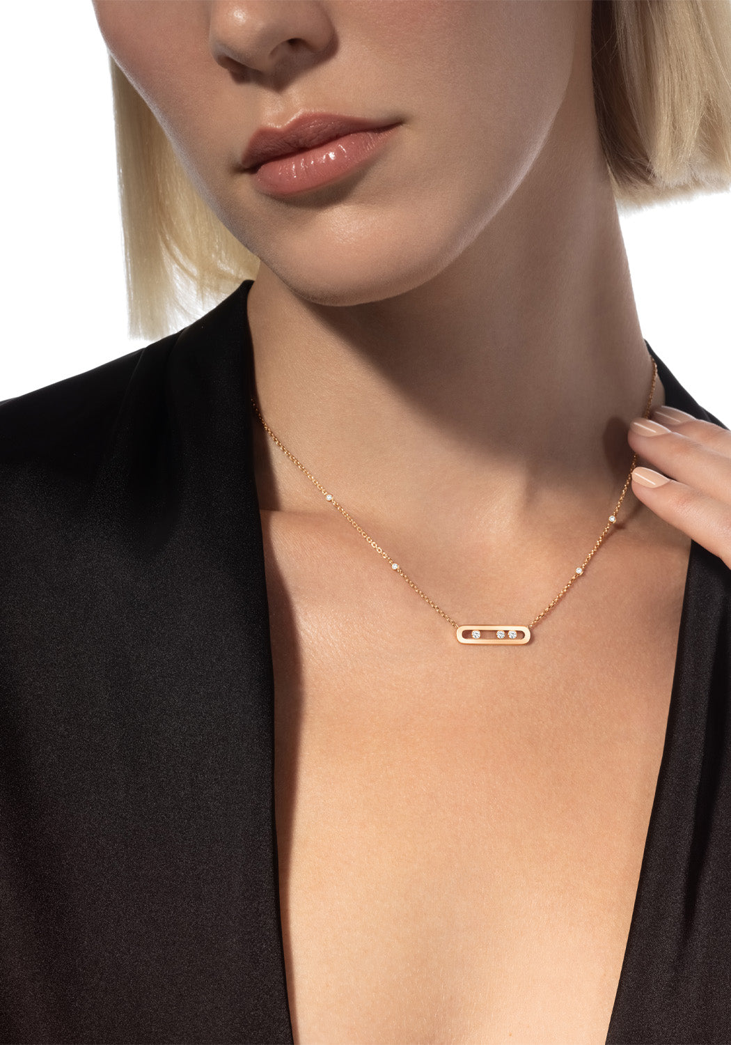 Blonde model wearing Messika Baby Move 18K Rose Gold Diamond Necklace with black blouse