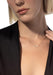 Blonde model wearing Messika Baby Move 18K Rose Gold Diamond Necklace with black blouse