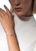 Messika Baby Move 18K Rose Gold Diamond Bracelet shown on model's wrist wearing a white blouse.