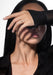 Brunette model wearing two Messika Move Uno Pavé 18KRG Diamond Rings on hand covering her eyes