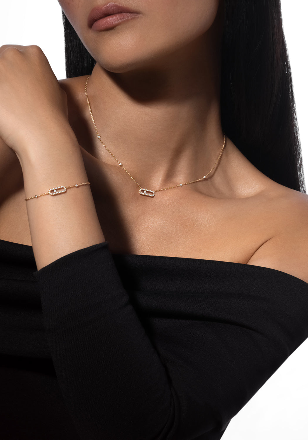 Model wearing Messika Move Uno Pavé 18K Rose Gold Diamond Necklace & Bracelet in black top
