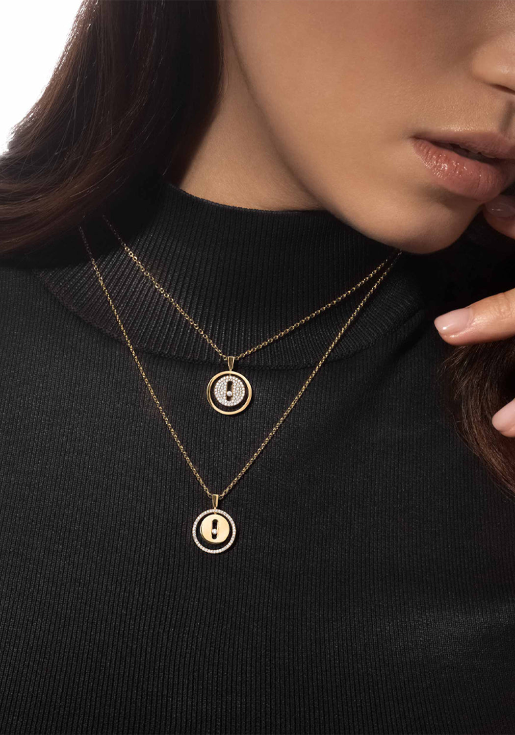 Closeup of brunette model wearing Messika Lucky Move PM Pavé Diamond 18KYG Necklace and a black top