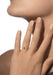 Closeup of a model with hand near face wearing a Messika Move Uno Smooth 18K White Gold Diamond Ring