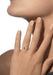 Closeup of a model with hand near face wearing a Messika Move Uno Smooth 18K White Gold Diamond Ring