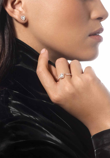 Closeup of Messika Joy Cœur 18KRG Diamond Heart Earring & ring on model in a leather jacket.