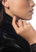 Closeup of Messika Joy Cœur 18KRG Diamond Heart Earring & ring on model in a leather jacket.