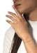 Brunette model in white shirt wearing Messika Move Uno Pavé LM 18KYG Pave Diamond Ring and bracelet