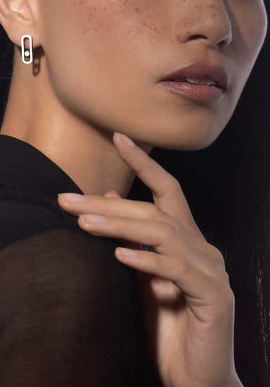 Close up of model's profile in a black top wearing Messika Move Uno 18K White Gold Diamond Earrings