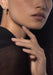 Close up of model's profile in a black top wearing Messika Move Uno 18K Yellow Gold Diamond Earrings