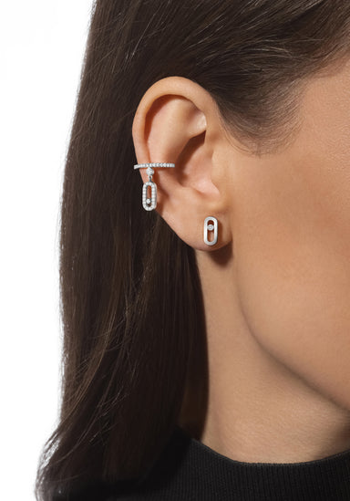 Closeup of a model wearing Messika Move Uno 18KWG Diamond Stud Earrings Styled with 2nd Pair