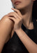 Brunette model wearing a Messika D-Vibes 18KRG Small Bezel Diamond Bracelet and ring (sold separate)