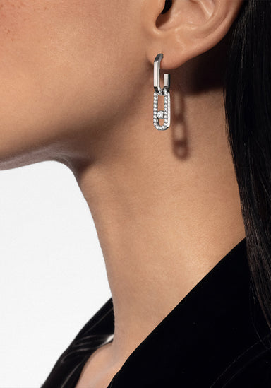 Closeup profile of model in a black shirt wearing a Messika Move Link 18KWG Pavé Diamond Earring
