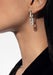 Closeup profile of model in a black shirt wearing a Messika Move Link 18KWG Pavé Diamond Earring