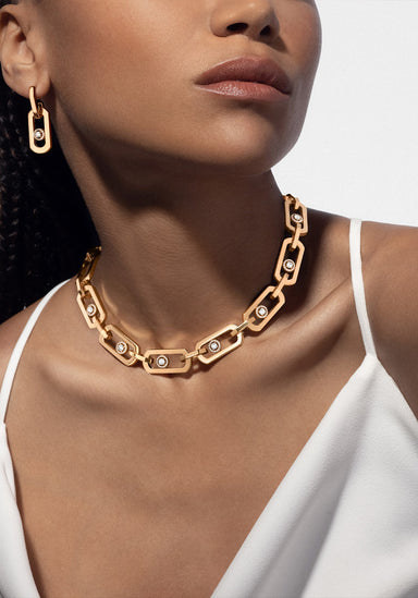 Black model wearing Messika So Move XL 18K Yellow Gold Diamond Pendant Earrings and necklace