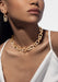 Black model wearing Messika So Move XL 18K Yellow Gold Diamond Pendant Earrings and necklace
