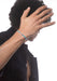 Messika Care(s) Blue Cord Pavé Diamond Bracelet on a tan curly haired brunette male model's wrist
