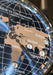 Close-up of a Moritz Grossmann world map clock dial, showing continents in beige over a blue globe background with white grid lines and city names. OsterJewelers.com