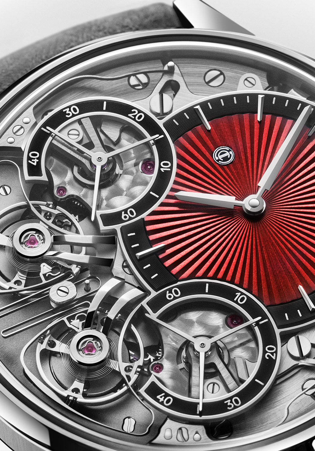Close up of the red off-center guilloché dial of the Armin Strom Mirrored Force Resonance Red