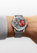Armin Strom Mirrored Force Resonance Red luxury watch is shown on a man's wrist with a grey sweater