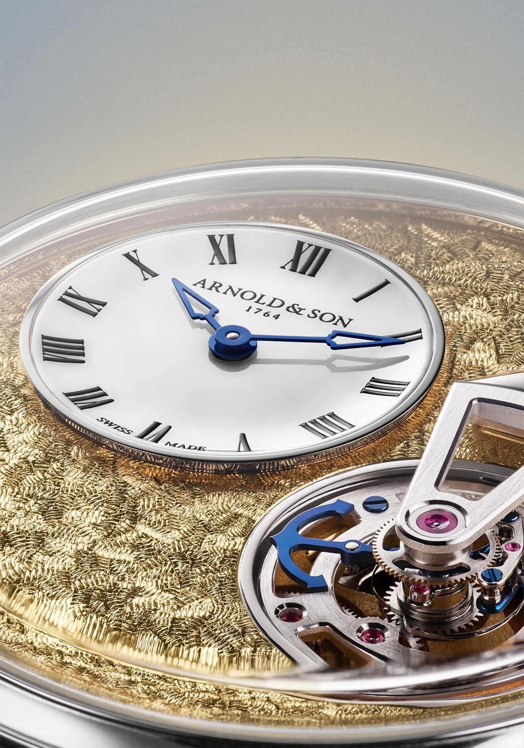 The white opal subdial of the Constant Force Tourbillon 11 Pt provides the hours & minutes.