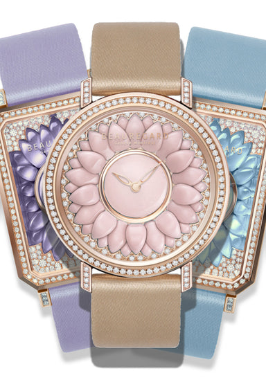 Three watches fanned out. One square purple gemstone watch, one tan and pink gemstone watch and one light blue gemstone watch.