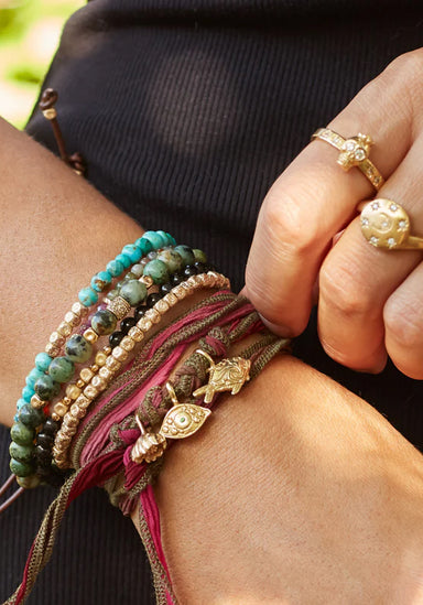 Catherine Michiels Sterling Silver Keola Fish Charm on Silk Wrap (Style Idea) | OsterJewelers.com