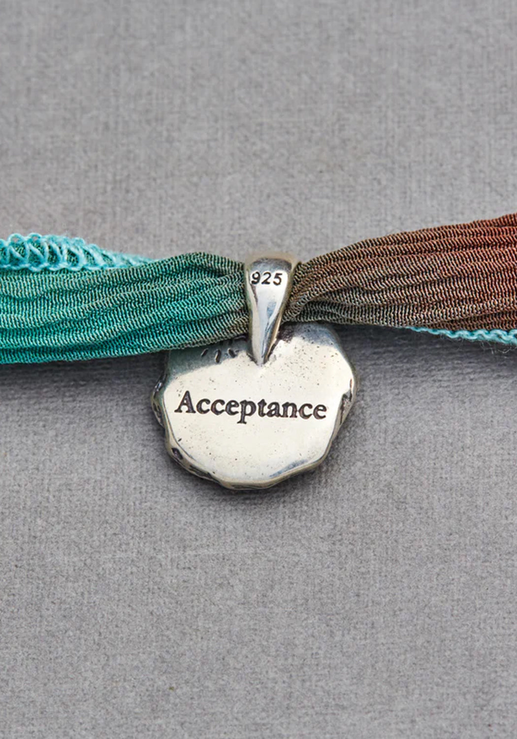 Catherine Michiels Sterling Silver Acceptance Charm on Silk Wrap | Denver | OsterJewelers.com