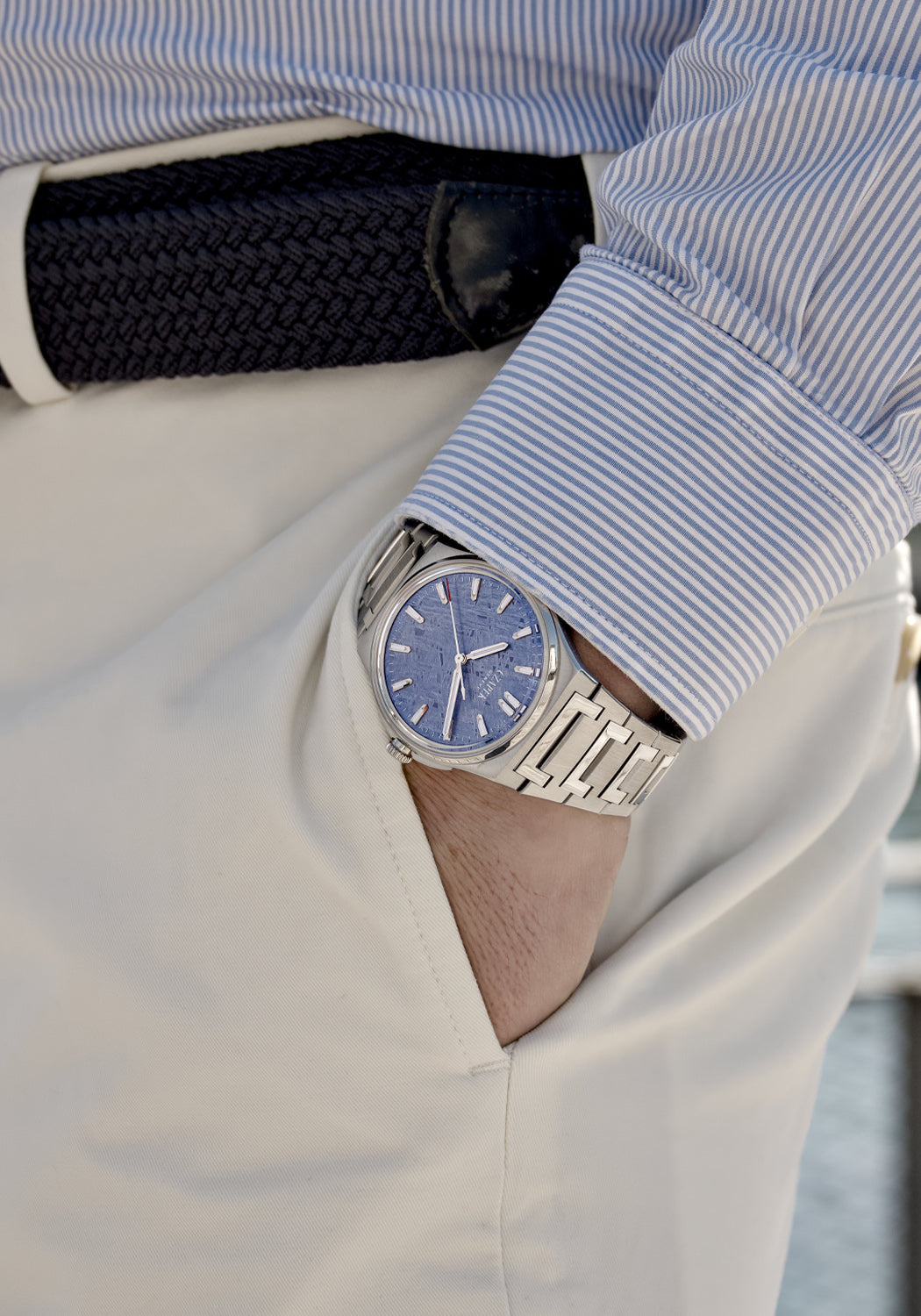 The blue dial of the Czapek & Cie Antarctique S Frozen Meteor stands out on a man's wrist
