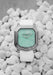 Gerald Charles Maestro 2.0 Ultra-Thin Jade with a white rubber strap on a white pebble background.