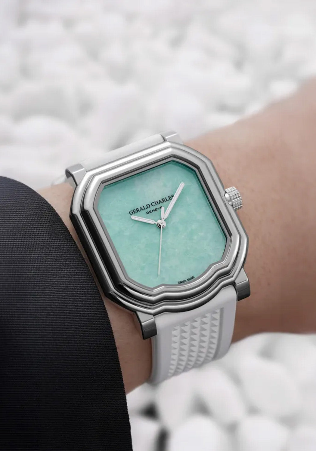 Gerald Charles Maestro 2.0 Ultra-Thin Jade shown on a wrist with with a white pebble background.