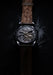A stylized caseback image of the Grönefeld 1941 Quadrivium Platinum