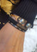 Woman wearing three bracelets. Pearl cuff, braided black diamond cord bracelet and stretch diamond bracelet at Oster Jewelers