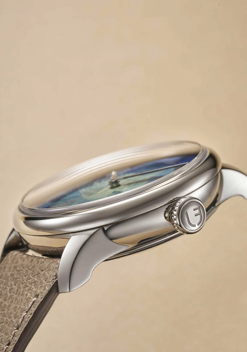 A side view of the Louis Erard Marqueterie de Paille showing the stainless steel lugs and crown.
