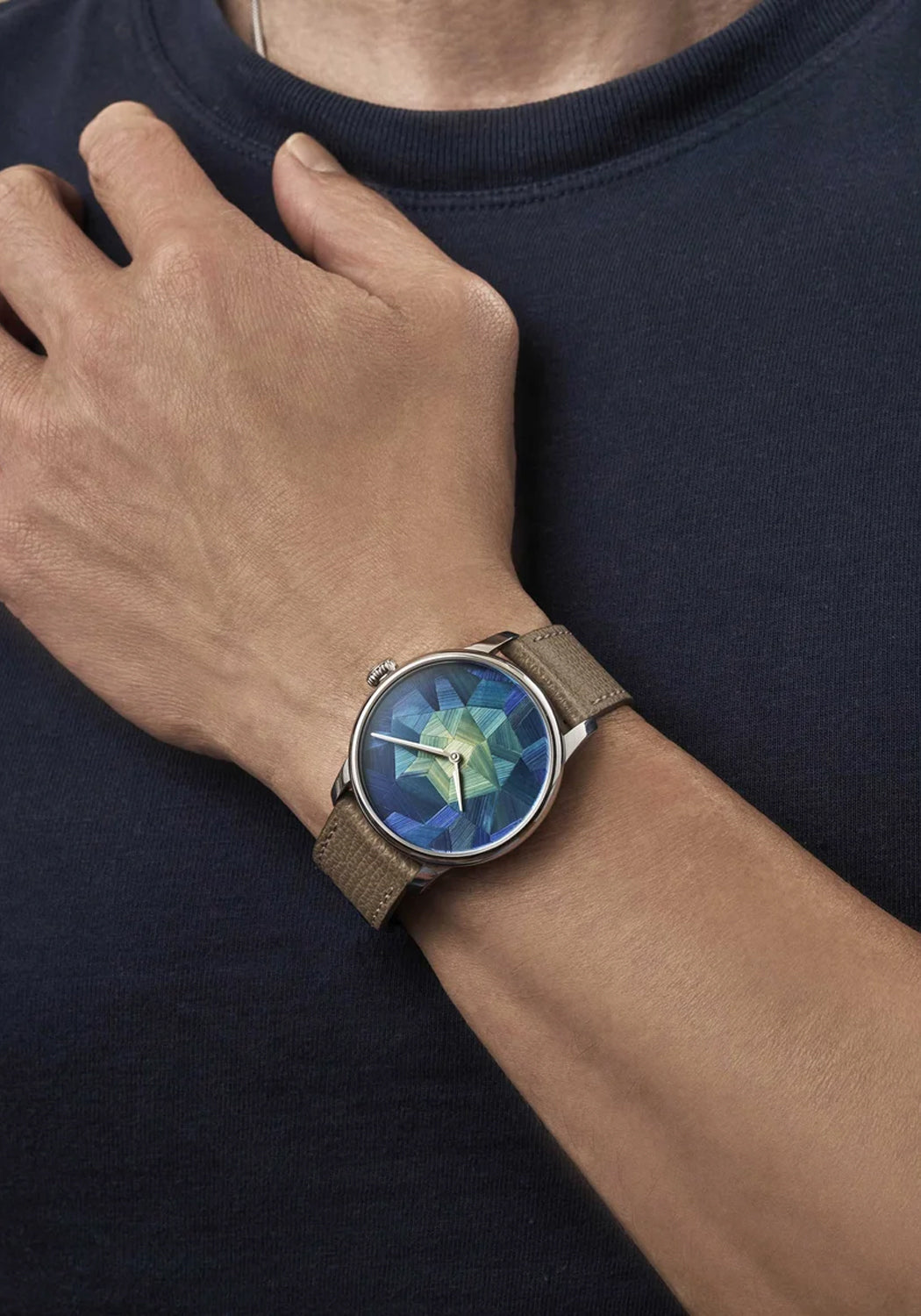 The Louis Erard Marqueterie de Paille on a man's wrist | Ref. 34248AA45.BVA158 | OsterJewelers.com