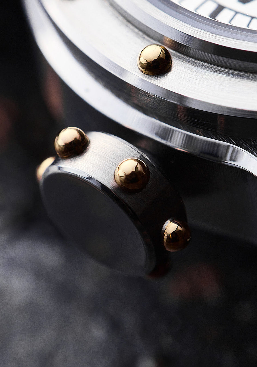Closeup of the yellow-gilt rivets on the crown of the Louis Erard x Vianney Halter Futur Antérior