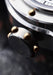 Closeup of the yellow-gilt rivets on the crown of the Louis Erard x Vianney Halter Futur Antérior