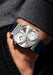 Louis Erard x Vianney Halter Futur Antérior Silver on a man's wrist | OsterJewelers.com
