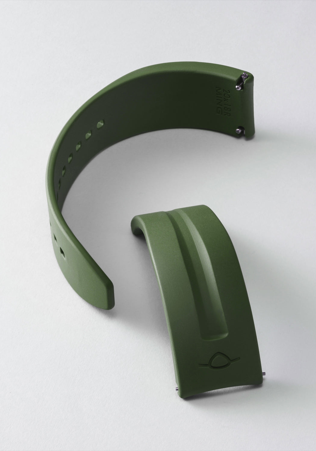 The MING FKM Forest Green Rubber Strap shown on its side in two pieces on a light background.