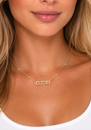 Model wearing a .15ctw diamond necklace wearing a white tank top.  Diamonds move in their own track. Necklace by Messika from Oster Jewelers