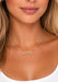 Model wearing a .15ctw diamond necklace wearing a white tank top.  Diamonds move in their own track. Necklace by Messika from Oster Jewelers
