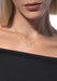 Messika Move Uno 18KYG Solitaire Diamond Necklace shown on a blonde model with black top