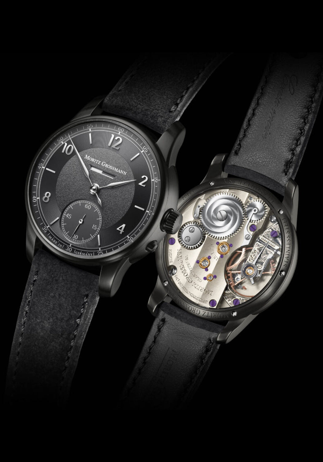 Front & back of Moritz Grossmann Benu Power Reserve Black Stainless Steel DLC on a black background