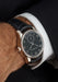 The Moritz Grossmann Hamatic Enamel White Gold on a man's wrist wearing a black suit