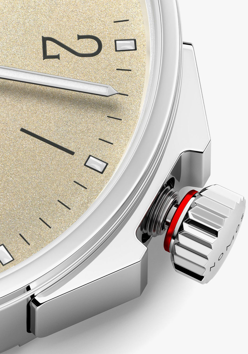 A closeup of the NOMOS Ahoi Neomatik Sand screw-down crown featuring a red warning ring.