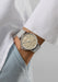 The NOMOS Ahoi Neomatik Sand features a light golden dial. Shown on a woman's wrist.