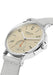 NOMOS Ahoi Neomatik Sand shown at an angle. The watch features a sand dial & orange seconds hand.