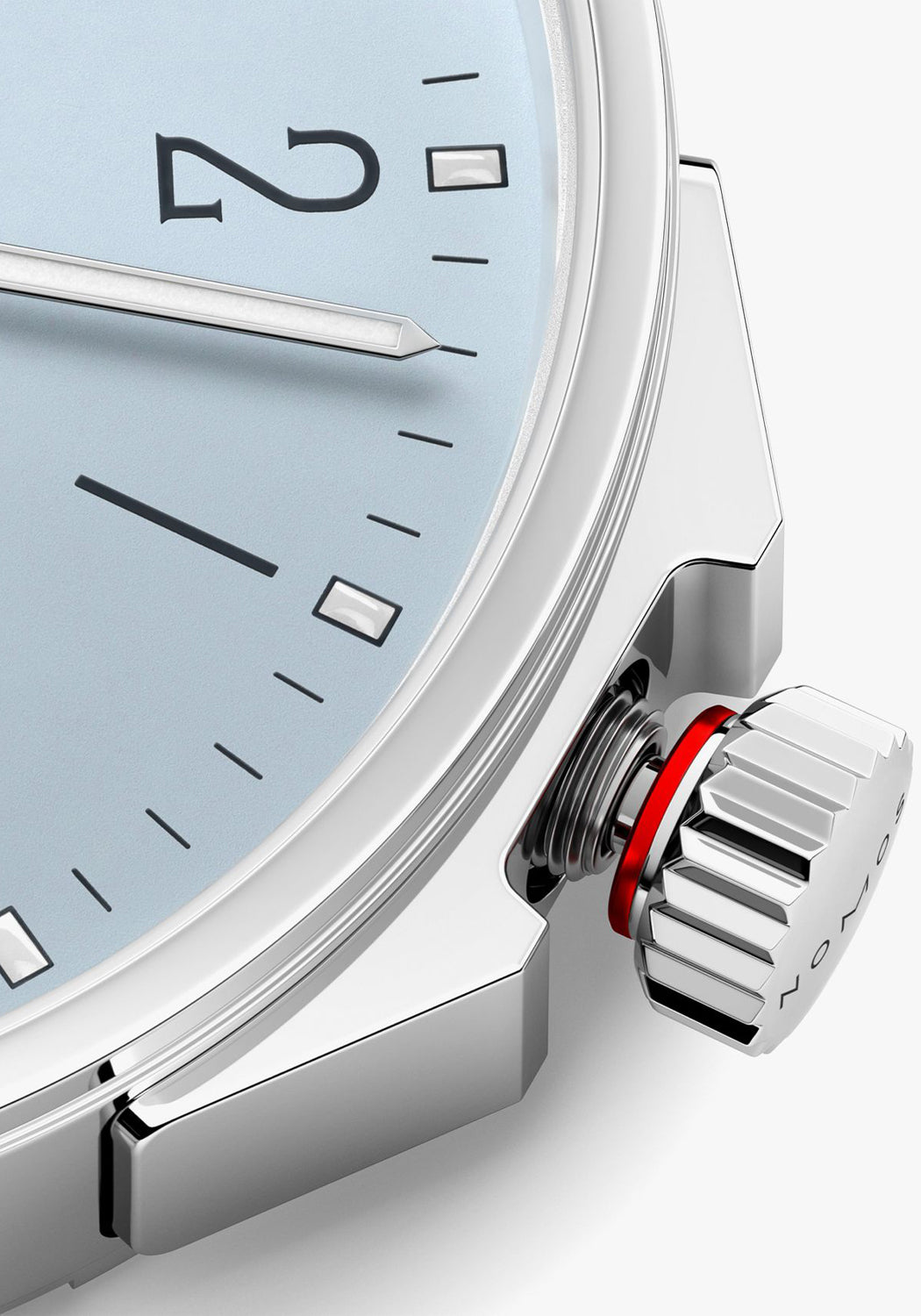 A closeup of the NOMOS Ahoi Neomatik Sky screw-down crown featuring a red warning ring.