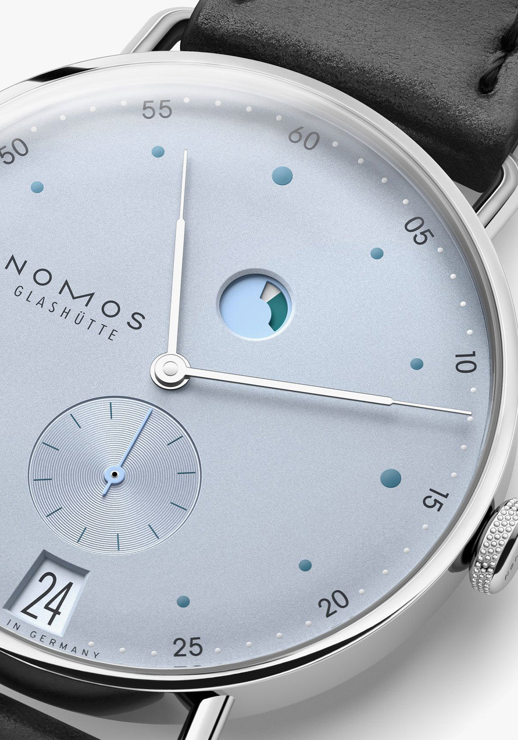 Closeup of the dial shows the power reserve and the seconds subdial azurage finish.